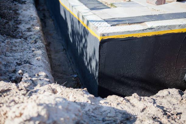 Professional Waterproofing technician working in Windsor, NJ
